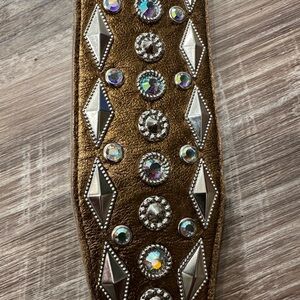Beautiful and blingy belt. Copper gold color with silver and rhinestone detail.